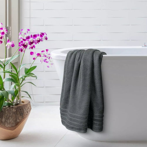 Rolled bath sheet towel with elegant décor